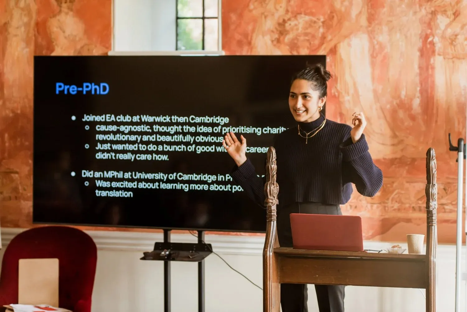 A speaker presenting to the room